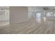 Open concept living room features wood floors, and sliding doors with access to backyard and swimming pool at 2820 Thunder Bay Ave, Henderson, NV 89052