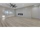 Well-lit living room featuring wood floors, a modern fireplace, and a bright window at 2820 Thunder Bay Ave, Henderson, NV 89052