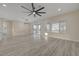 Bright and open living room featuring wood floors, backyard access, and an open concept floorplan at 2820 Thunder Bay Ave, Henderson, NV 89052