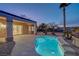 Evening view of the pool with the covered patio at 2820 Thunder Bay Ave, Henderson, NV 89052