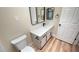 Bathroom featuring modern vanity with black hardware, toilet, and wood-style floors at 2851 S Valley View Blvd # 1153, Las Vegas, NV 89102