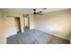 Bedroom showcases carpet, ceiling fan, and closet with mirrored sliding doors at 2851 S Valley View Blvd # 1153, Las Vegas, NV 89102