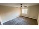 Bedroom features carpeted floor, a ceiling fan, and natural light from a window at 2851 S Valley View Blvd # 1153, Las Vegas, NV 89102