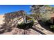 Exterior view of home with desert landscaping and mature shade trees at 2851 S Valley View Blvd # 1153, Las Vegas, NV 89102