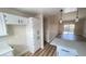 Open kitchen with cabinets and stainless steel appliances leading to the living room at 2851 S Valley View Blvd # 1153, Las Vegas, NV 89102