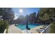 Community pool featuring lounge chairs, shade trees, and clubhouse in the background at 2851 S Valley View Blvd # 1153, Las Vegas, NV 89102