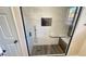 Shower featuring elegant white marble style tile, contrasting fixtures, and a built in bench at 2851 S Valley View Blvd # 1153, Las Vegas, NV 89102