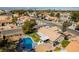 Aerial view of house, backyard pool, landscaping, patio, and neighborhood at 3083 Paintedhills Ave, Las Vegas, NV 89120