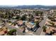 Scenic aerial view of a home with a beautiful pool, landscaping, and RV parking in a quiet neighborhood at 3083 Paintedhills Ave, Las Vegas, NV 89120