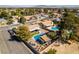 Aerial of neighborhood, pools, landscaping, and outdoor living space at 3083 Paintedhills Ave, Las Vegas, NV 89120