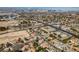 Aerial community view, residential street with city skyline and mountain views in background at 3083 Paintedhills Ave, Las Vegas, NV 89120