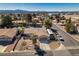 Aerial view of a house with xeriscape landscaping, decorative rock, brick walkway, and RV parking at 3083 Paintedhills Ave, Las Vegas, NV 89120
