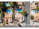 Aerial view showcasing a home with a private pool, patio, and RV parking, nestled in a neighborhood at 3083 Paintedhills Ave, Las Vegas, NV 89120