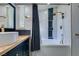 This bathroom features a tub/shower with tile surround and a vanity with brass fixtures at 3083 Paintedhills Ave, Las Vegas, NV 89120
