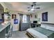 A well-lit bedroom with playful décor, ceiling fan, and neutral walls at 3083 Paintedhills Ave, Las Vegas, NV 89120