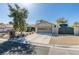 House with xeriscape landscaping, decorative rock, brick walkway, RV parking, and a multi-car garage at 3083 Paintedhills Ave, Las Vegas, NV 89120
