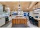 Bright kitchen features modern appliances, butcher block island, and eat-in dining space at 3083 Paintedhills Ave, Las Vegas, NV 89120