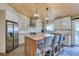 Modern kitchen with stainless steel appliances, butcher block island, ample cabinet space, and stylish light fixtures at 3083 Paintedhills Ave, Las Vegas, NV 89120