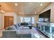 Bright living room featuring an entertainment center, a cozy couch, hardwood ceiling and a double door entry at 3083 Paintedhills Ave, Las Vegas, NV 89120
