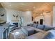 Bright living room featuring a fireplace, hardwood ceiling and a cozy sectional couch at 3083 Paintedhills Ave, Las Vegas, NV 89120
