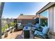 Cozy patio area with a fire pit, brick pavers, and comfortable outdoor seating at 3083 Paintedhills Ave, Las Vegas, NV 89120