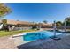 Private backyard pool with diving board, lounge area, and brick paver accents offer relaxation and recreation at 3083 Paintedhills Ave, Las Vegas, NV 89120