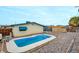 Backyard featuring an inviting swimming pool, a pergola, and low-maintenance gravel landscaping at 3247 Greenbriar Dr, Las Vegas, NV 89121