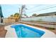 Backyard showcasing a bright blue in-ground swimming pool, pergola, and gravel-covered landscaping at 3247 Greenbriar Dr, Las Vegas, NV 89121