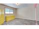Bedroom with wood floors, closet and mirror, and a yellow dresser and armoire at 3247 Greenbriar Dr, Las Vegas, NV 89121