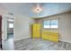 Bright bedroom with wood floors, closet and mirror, and a yellow dresser and armoire at 3247 Greenbriar Dr, Las Vegas, NV 89121
