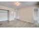 Neutral-colored bedroom with light gray floors, closet, bathroom access, and natural light from window at 3247 Greenbriar Dr, Las Vegas, NV 89121