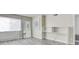 Bedroom featuring gray wood floors, neutral colored walls, closet space and built-in white shelving at 3247 Greenbriar Dr, Las Vegas, NV 89121