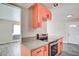 Modern kitchen showcasing quartz countertops and an open layout to the living area at 3247 Greenbriar Dr, Las Vegas, NV 89121
