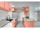 Modern kitchen featuring quartz countertops, stainless steel appliances, and ample storage space at 3247 Greenbriar Dr, Las Vegas, NV 89121