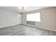 Bright living room with modern flooring and a large window offering plenty of natural light at 3247 Greenbriar Dr, Las Vegas, NV 89121