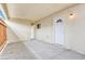 Enclosed back patio with overhead cover, offering shade and privacy with a door to the interior at 3247 Greenbriar Dr, Las Vegas, NV 89121