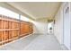 Covered patio with a wooden fence, with room for outdoor seating and backyard access at 3247 Greenbriar Dr, Las Vegas, NV 89121