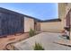 Spacious backyard area with concrete patio, mature landscaping, and privacy fence at 3301 China Dr, Las Vegas, NV 89121