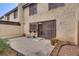Enjoy the outdoors in this cozy backyard with patio, mature landscaping, and security features at 3301 China Dr, Las Vegas, NV 89121