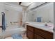 Bathroom with full tub, shower, modern hardware, sink, and tile flooring at 3301 China Dr, Las Vegas, NV 89121