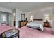 Large bedroom featuring a king bed, hardwood furniture, and a large window at 3301 China Dr, Las Vegas, NV 89121