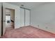 Cozy bedroom features neutral walls, carpet, and a closet with sliding doors at 3301 China Dr, Las Vegas, NV 89121