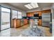 Bright kitchen featuring wood cabinets, stainless steel appliances, and a sliding glass door to the outdoor patio at 3301 China Dr, Las Vegas, NV 89121