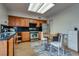 Well-lit kitchen with wooden cabinets, stainless steel appliances, and eat-in dining area at 3301 China Dr, Las Vegas, NV 89121