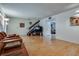 Comfortable living area with hardwood floors, staircase, and an adjacent dining area at 3301 China Dr, Las Vegas, NV 89121