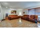 Well-lit living room with hardwood floors, large window, and contemporary furnishings at 3301 China Dr, Las Vegas, NV 89121