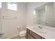 Clean bathroom with a vanity, toilet, and shower with a curtain and built-in shelves at 3346 Esker Ridge Ave, Henderson, NV 89044
