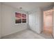 Bright bedroom with a large window offering sunset views and a closet with sliding doors at 3346 Esker Ridge Ave, Henderson, NV 89044