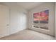 Cozy bedroom with carpet, closet with sliding doors, and a large window view of mountains at 3346 Esker Ridge Ave, Henderson, NV 89044