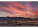 A beautiful dusk shot overlooking a city with mountains on the horizon at 3346 Esker Ridge Ave, Henderson, NV 89044